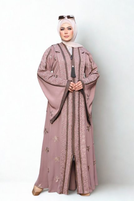 Elegant mauve embroidered abaya with floral patterns and front tassel detail, styled with hijab and sunglasses.